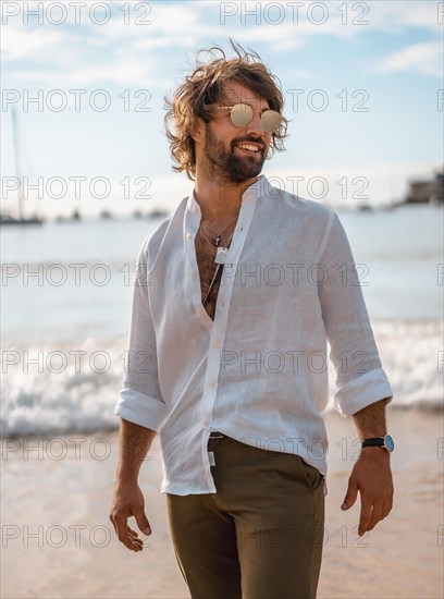 Summer lifestyle with a young dark-haired Caucasian man with long beard