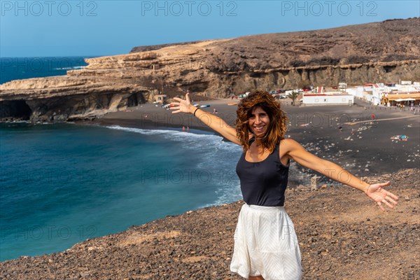 A young girl on vacation on the beach of Ajuy