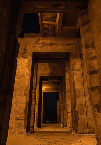 Beautiful columns of the Kom Ombo temple at night illuminated