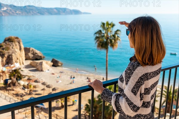 A young woman tourist on Calahonda beach in the town of Nerja