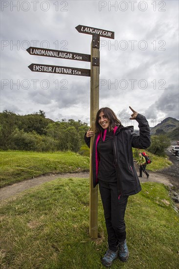 A young woman at the 54 km Thorsmoerk signal of the 4-day trek to Landmannalaugar. Iceland