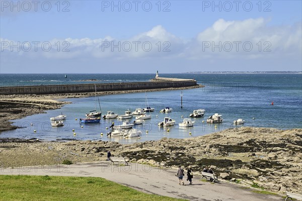 Motorboats in rocky bay