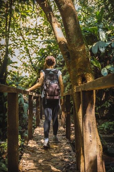 A young tourist inside a bridge in the Cerro Azul Meambar National Park