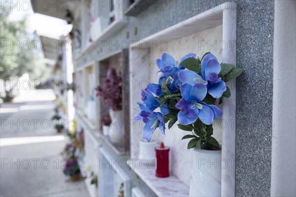 Wall with decorated urns graves in a cemetery in Sardinia