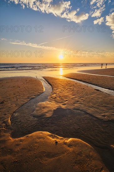 Atlantic ocean sunset with surging waves at Fonte da Telha beach