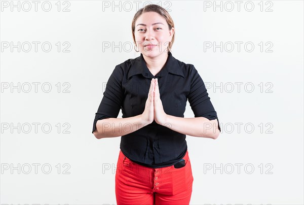 Attractive young woman asking for a favor isolated. Latin girl asking for help with her hands isolated