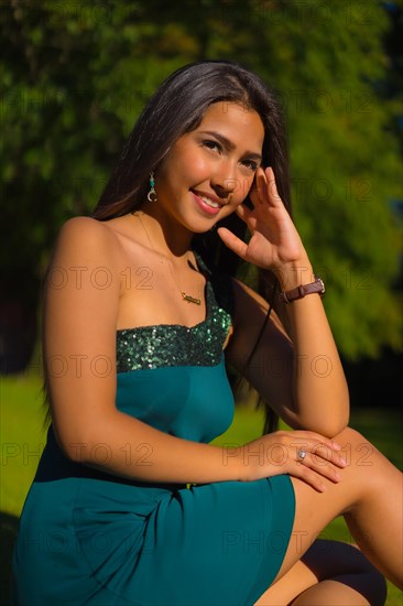 A pretty young brunette Latina with long straight hair