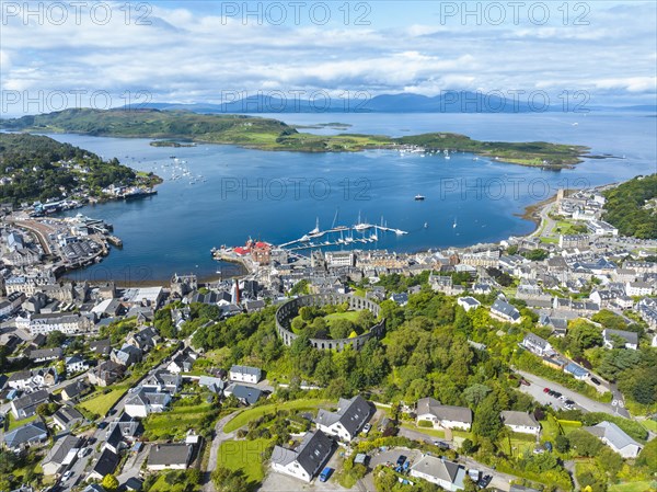 Aerial view of the harbour town of Oban with McCaig's Tower