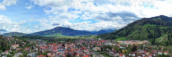 Aerial view of Immenstadt im Allgaeu with a view of the Alps. Immenstadt im Allgaeu