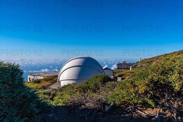 Observatories of the Roque de los Muchachos in the Caldera de Taburiente with a sea of nuts below one summer afternoon