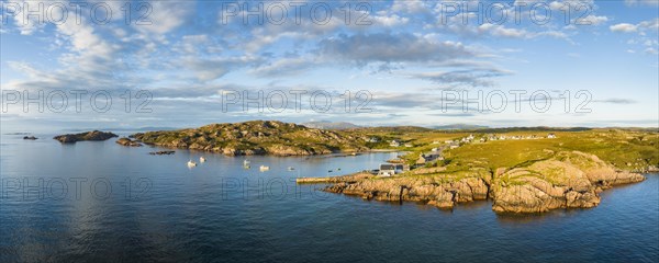 Aerial panorama of the coastline of the Ross of Mull peninsula with the fishing village of Fionnphort