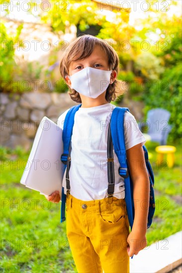 Caucasian child with face mask ready for back to school. New normality