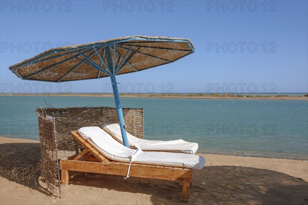 Parasol and sun loungers