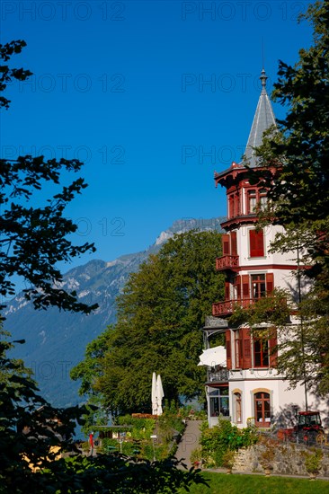 The Historical Grandhotel Giessbach on the Mountain Side in Giessbach