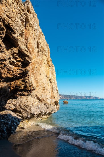 Detail of the sea in the small coves on Calahonda beach in the town of Nerja