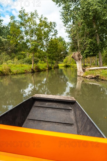 Sailing by boat on the natural water channels between La Garette and Coulon