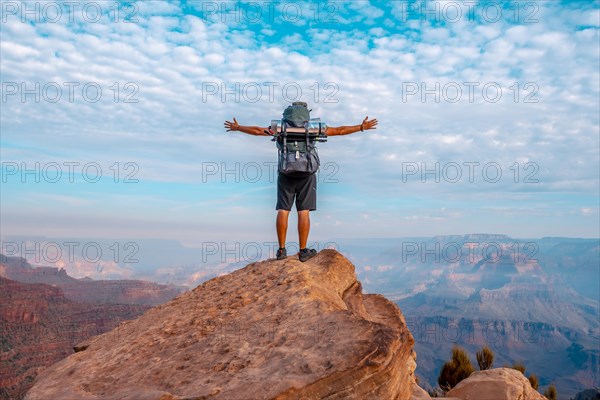 A young man on a viewpoint of the descent of the South Kaibab Trailhead. Grand Canyon