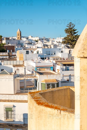 Aerial view at sunset of the white houses of Conil de la Frontera from the Torre de Guzman