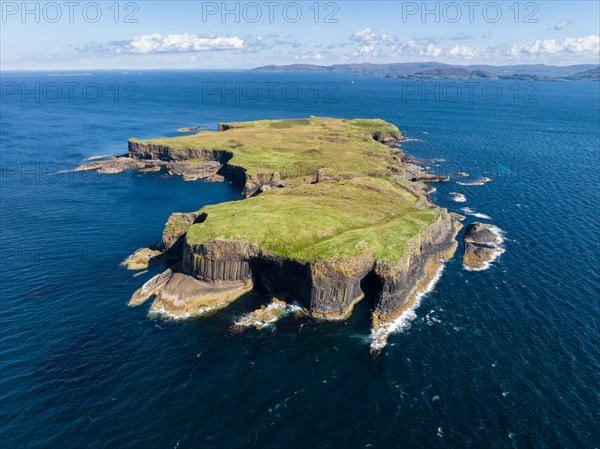 Aerial view of the uninhabited rocky island of Staffa with the prominent basalt columns and Fingal's Cave