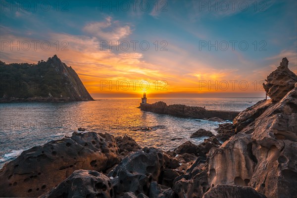 The sun hiding in the Lighthouse in Pasajes San Juan near San Sebastian