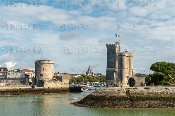 The beautiful entrance with the towers of the fort in La Rochelle. Coastal town in southwestern France