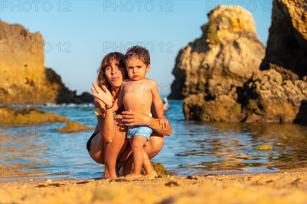 Portrait of a mother with her son at Praia dos Arrifes