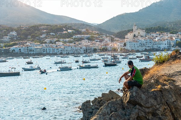 A young tourist on summer vacation in Cadaques by the sea