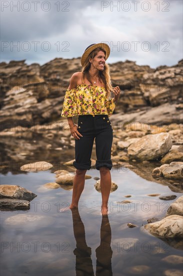 Caucasian blonde girl in a floral shirt