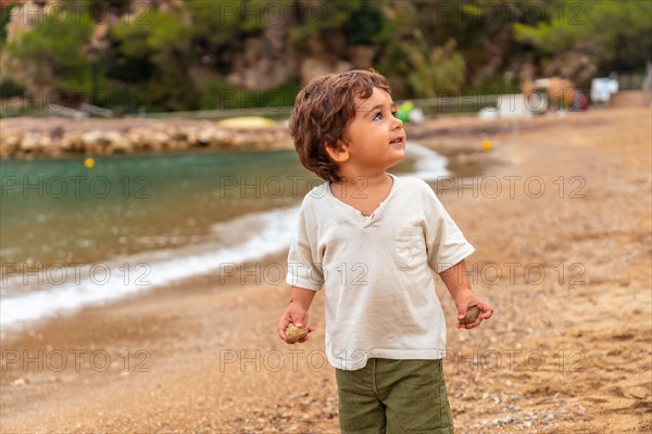 A child having fun on the beach in the port of Sant Miquel