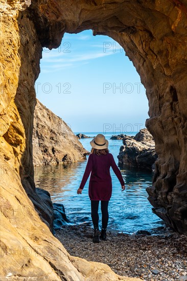 A young tourist girl with a hat in the Almanzora caves