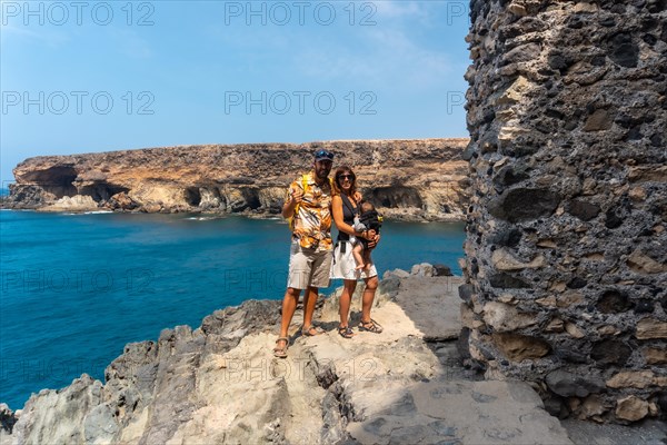 A family with their son in the Cuevas de Ajuy