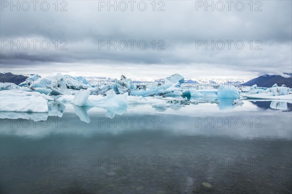 Beautiful icebergs on Jokulsarlon Ice Lake in the golden circle of southern Iceland on a cold August morning