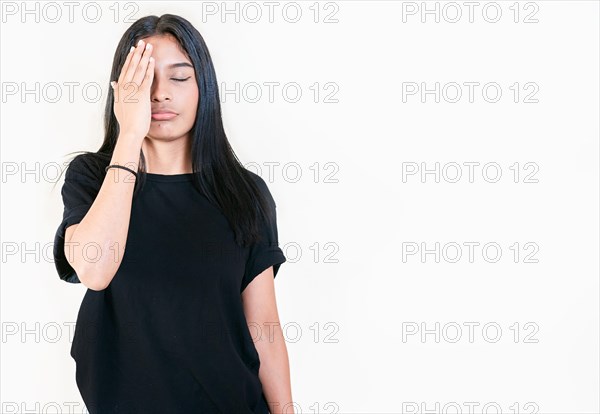 Exhausted people with palm on forehead isolated. Tired and exhausted young girl holding her forehead. Worried young woman holding his forehead