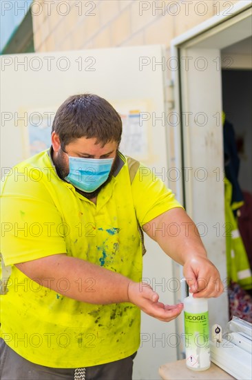 Worker in a recycling factory or clean point and garbage with a face mask and with security protections