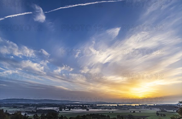 Sunrise at Lake Constance nature reserve Zeller Aachried with autumn fog