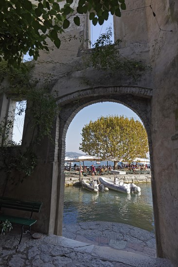 Gateway with view of idyllic harbour and pier