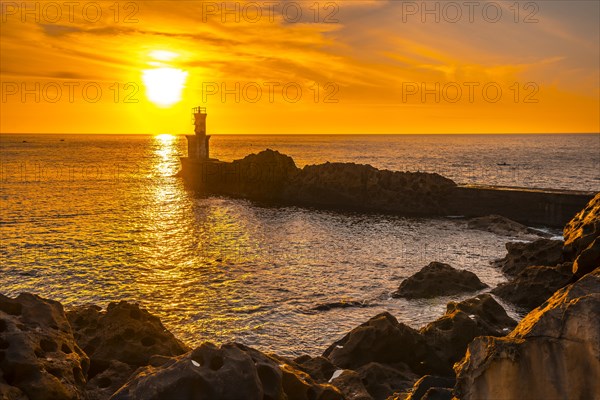 Detail of the lighthouse in the beautiful sunset of the town of Pasajes San Juan. Gipuzkoa