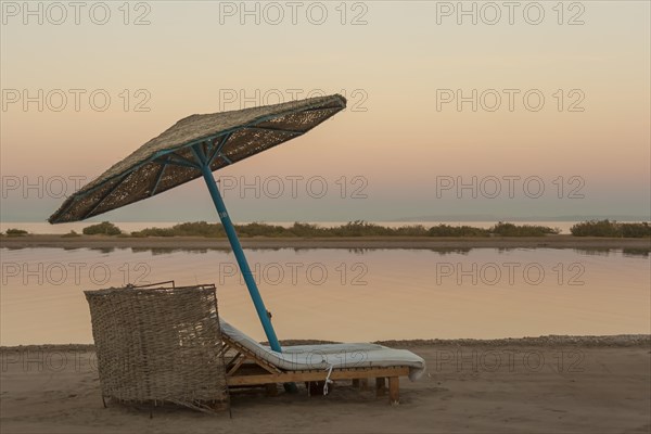 Parasol and sun loungers