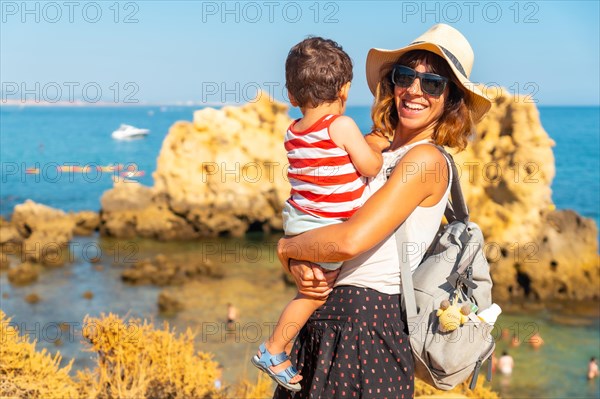 Mother with her son at Praia dos Arrifes