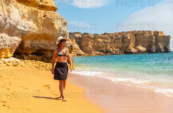 Strolling in summer on vacation on the beach at Praia da Coelha