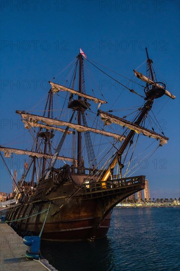 Old boat in the promenade of Muelle Uno in the Malagaport of the city of Malaga