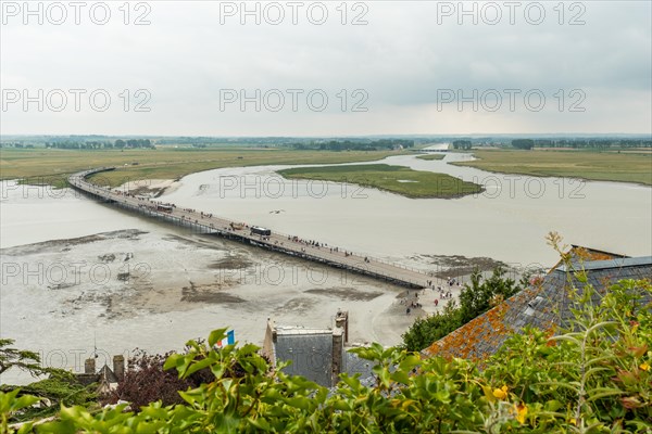 The arrival trail to the famous Mont Saint-Michel Abbey at high tide in the Manche department