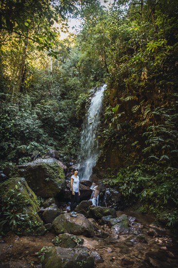 A cheerful young woman in the Cascada del Cerro Azul Meambar National Park