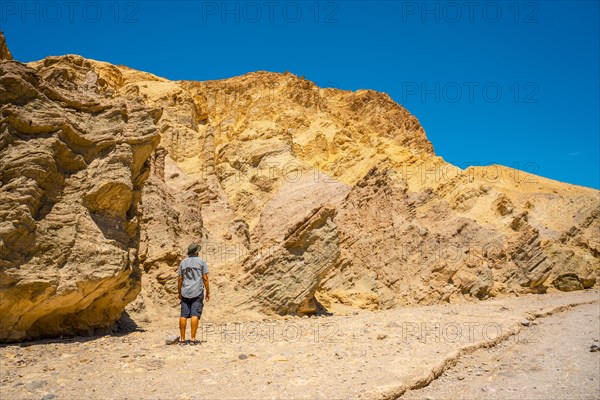 A man on the Golden Canyon trail enjoying the surrounding colors