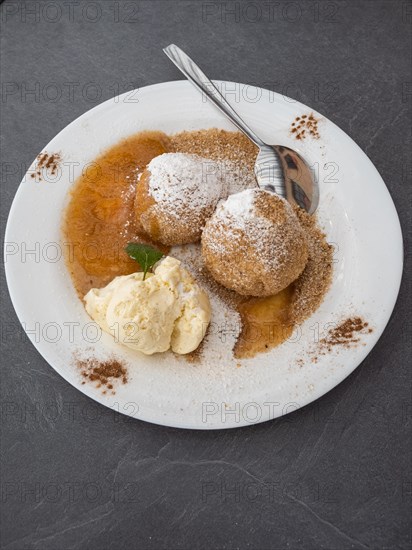 Apricot dumplings with sugar and cinnamon