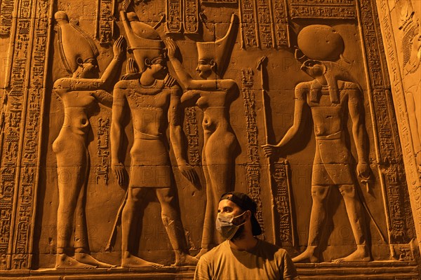 A young man visiting the beautiful temple of Kom Ombo at night