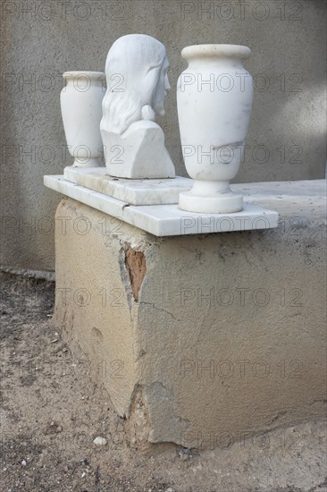 Simple grave with crumbling plaster