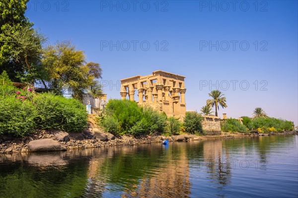 The beautiful temple of Philae and the Greco-Roman buildings seen from the Nile river