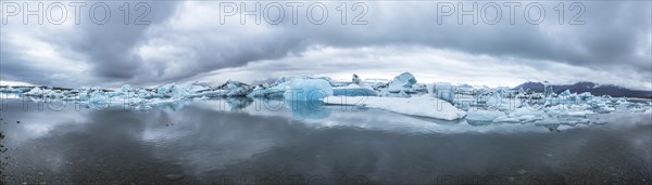 Beautiful icebergs on Jokulsarlon Ice Lake in the golden circle of southern Iceland on a cold August morning