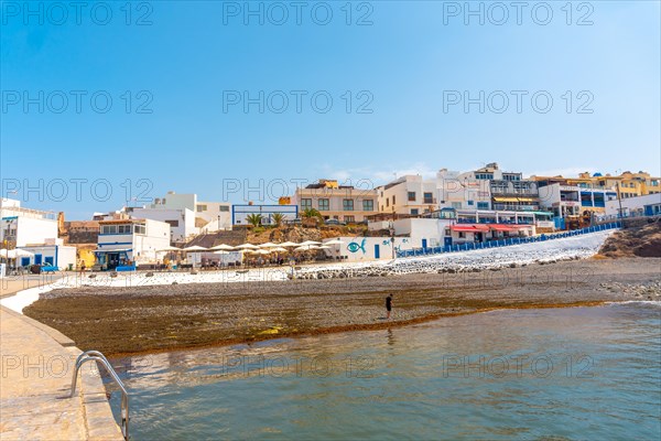 Black beach of the tourist town of El Cotillo in the north of the island of Fuerteventura